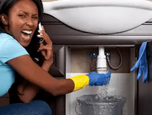 Emergency plumbing repair for a leaking sink drain under a bathroom vanity in San Jose, CA