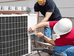 HVAC technicians repairing an outdoor AC unit on a rooftop in San Jose, CA