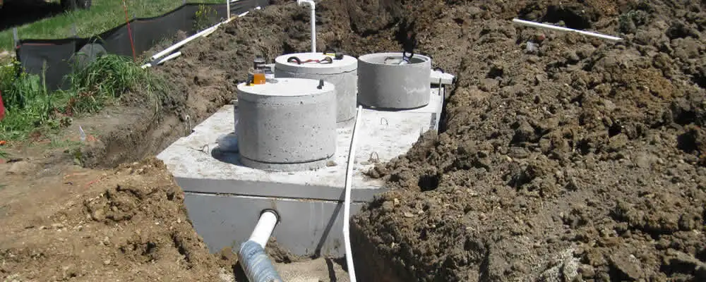 Septic system repair and installation site with tank access ports in San Jose, CA